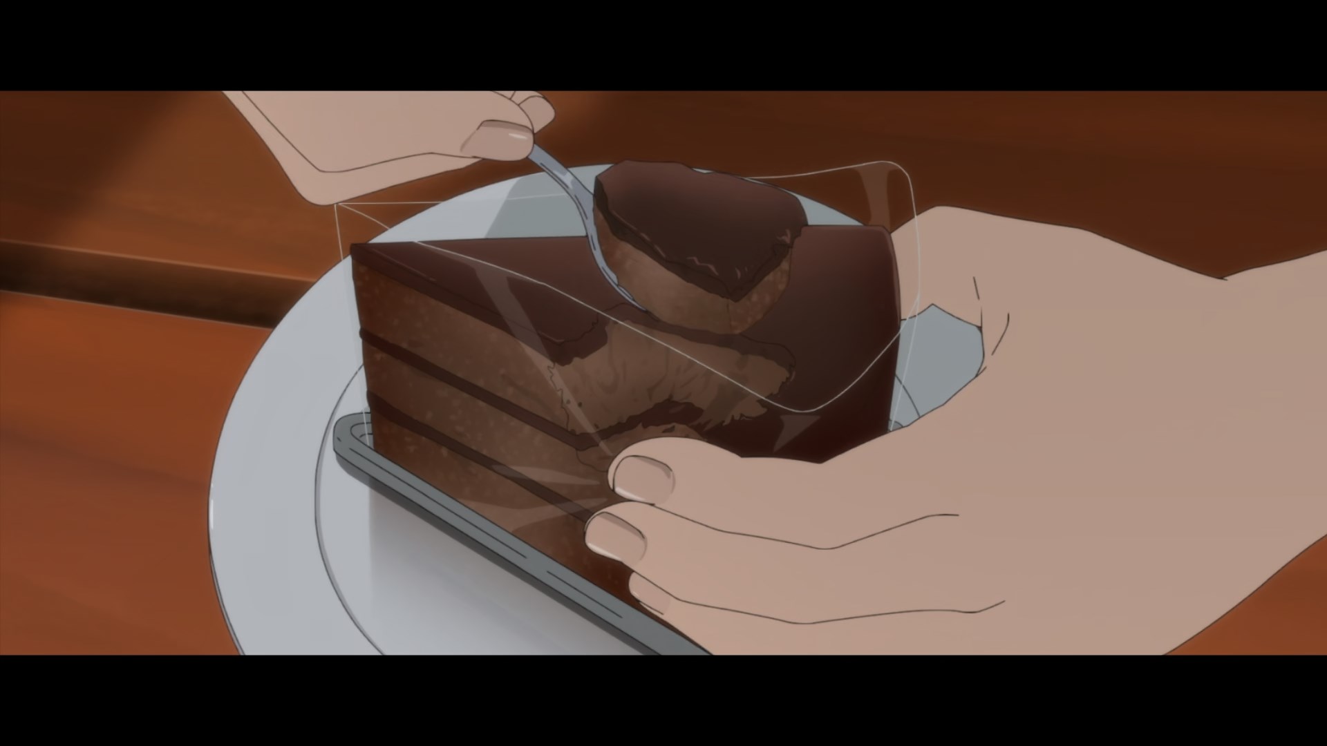 Who eats a slice of cake by leaving the plastic on around it and taking a bit from the middle?